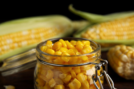 Tasty sweet corn kernels in jar, closeup viewの写真素材
