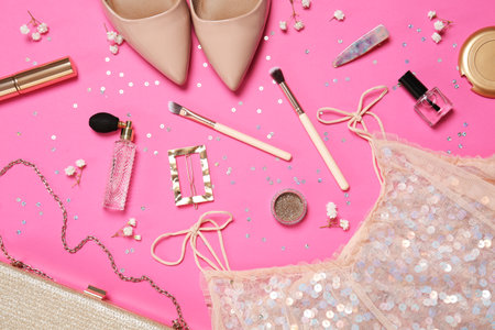 Flat lay composition with women's accessories, stylish shoes and dress on pink backgroundの写真素材