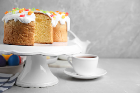 Easter cakes on light gray marble table. Space for text