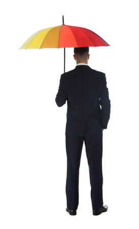 Businessman with rainbow umbrella on white background, back viewの写真素材