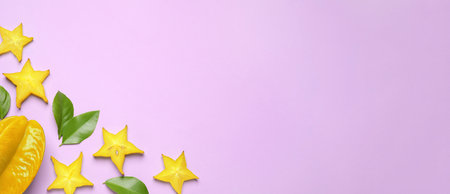 Delicious carambola fruits on violet background, flat lay. Space for text