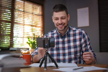 Teacher conducting online lesson at home during COVID-19 quarantineの写真素材