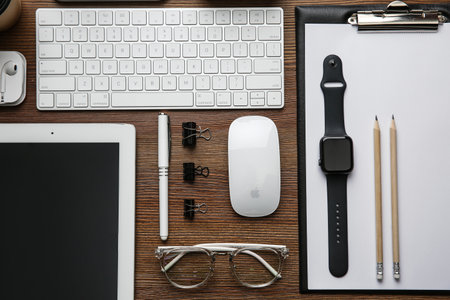 MYKOLAIV, UKRAINE - JULY 20, 2020: Flat lay composition with different Apple gadgets on wooden tableのeditorial素材