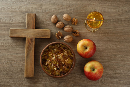 Cross and fasting meals on wooden table, flat lay. Lent seasonの写真素材