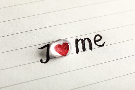 Phrase I Love Me written on paper, closeup viewの写真素材