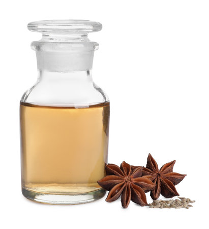 Anise essential oil and spice on white backgroundの写真素材