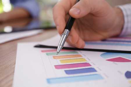 Business people working with charts and graphs at table in office, closeup. investment analysisの写真素材