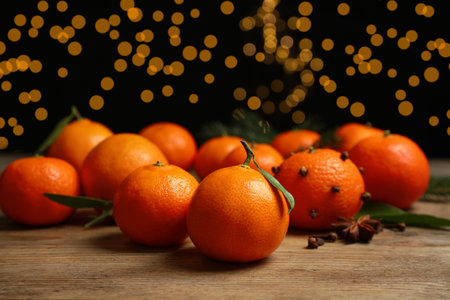 Fresh tangerines on wooden table, space for text. christmas atmosphereの写真素材