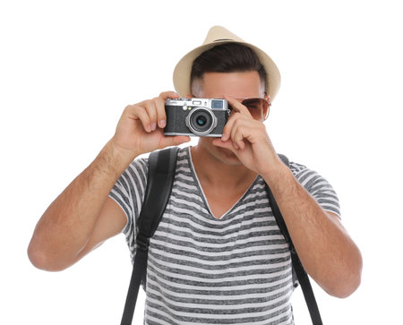 Man with straw hat taking picture on white background. summer travelの写真素材