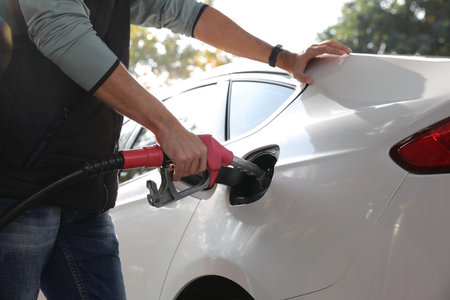 Man refueling car at self service gas station, closeupの写真素材