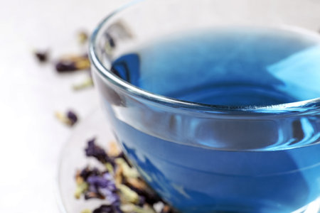 Glass cup of organic blue Anchan, closeup. herbal teaの写真素材