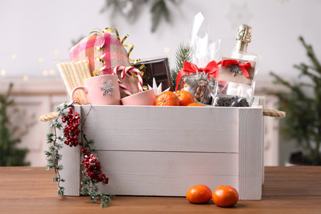 White crate with Christmas gift set on wooden table