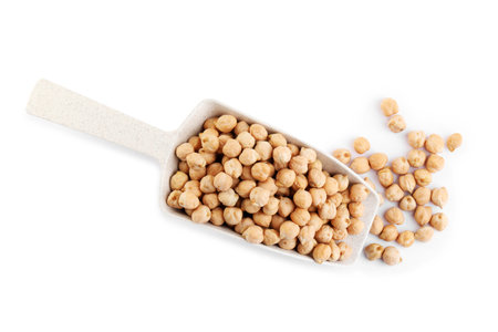 Scoop with chickpeas on white background, top view. natural foodの写真素材