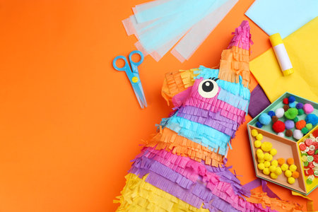 Flat lay composition with cardboard donkey on orange background, space for text. pinata diyの写真素材