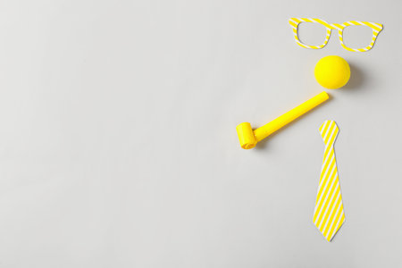 Different clown's accessories on light background, flat lay. Space for textの写真素材