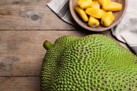 Fresh exotic jackfruit on wooden table, above viewの写真素材