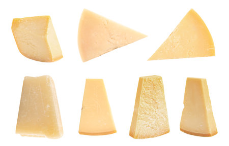 Set with pieces of delicious parmesan cheese on white backgroundの写真素材