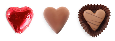 Set with delicious heart shaped chocolate candies on white background, top view. banner designの写真素材