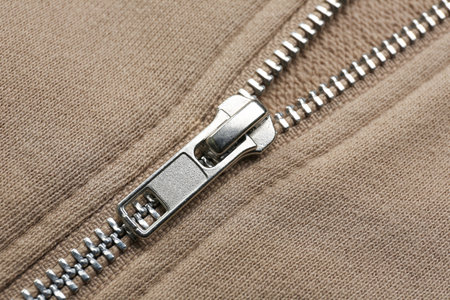 Closeup view of beige sweatshirt with zipper as backgroundの写真素材