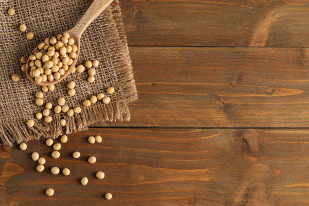Soy on wooden table, flat lay. Space for textの写真素材