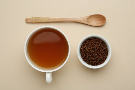 Buckwheat tea and granules on beige background, flat layの写真素材
