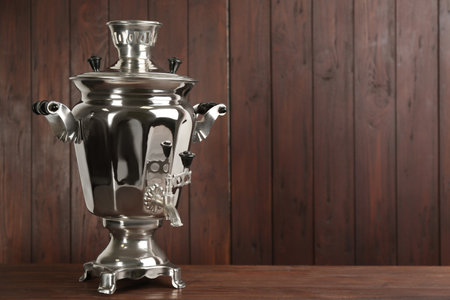 Traditional Russian samovar on wooden background. Space for textの写真素材