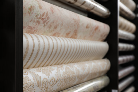 Assortment of stylish wall papers on display in shop, closeupの写真素材