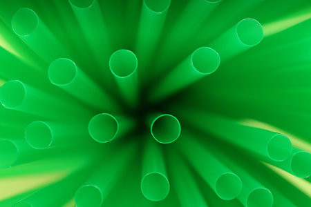Heap of green plastic straws for drinks, closeupの写真素材