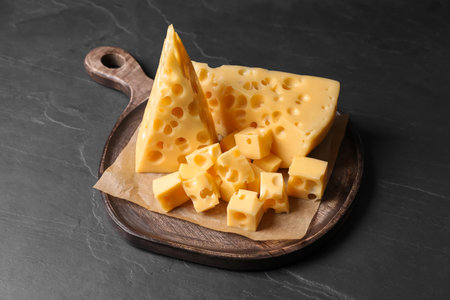 Tasty fresh cheese on dark gray tableの写真素材