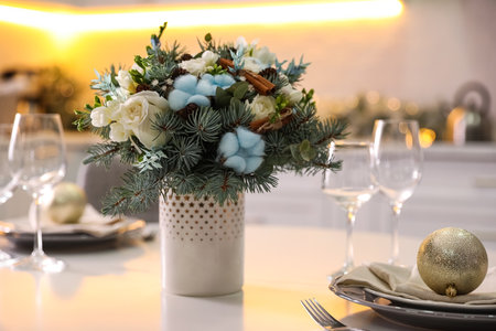 Beautiful winter bouquet on white table in kitchenの写真素材