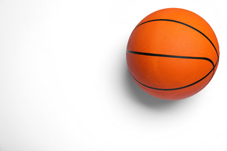 Orange ball on white background, top view. basketball equipmentの写真素材