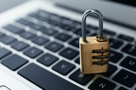 Metal code padlock on laptop keyboard, space for text. cyber security concept