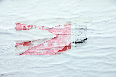 Creased torn poster and white paper as backgroundの写真素材