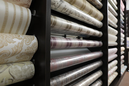 Assortment of stylish wall papers on display in shopの写真素材