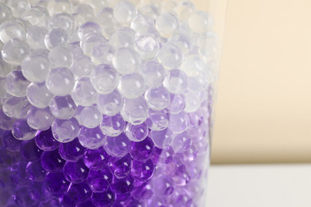 Different color fillers in glass vase, closeup. water beadsの写真素材