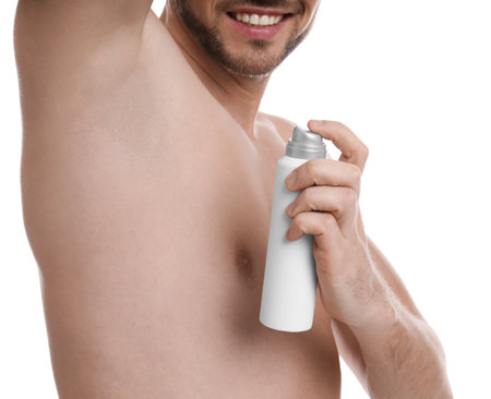Man applying deodorant isolated on white, closeupの写真素材