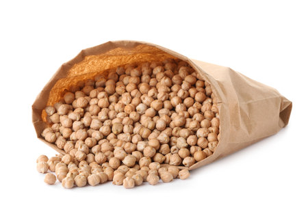 Raw chickpeas in bag on white backgroundの写真素材