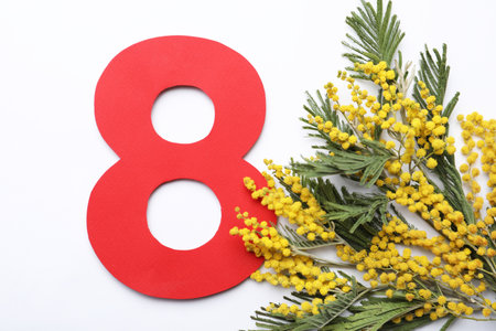 8 March greeting card design with beautiful mimosa flowers on white background, flat layの写真素材