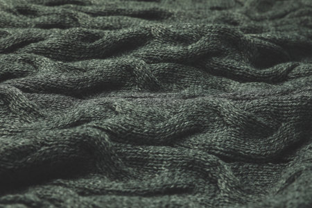 Knitted gray soft woolen fabric, closeup viewの写真素材