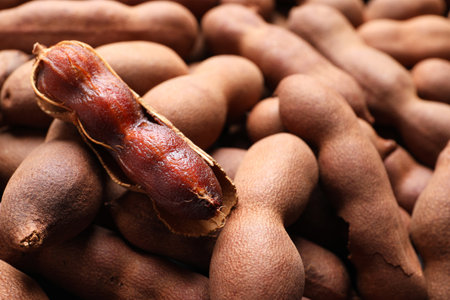 Delicious ripe tamarinds as background, closeup. exotic fruitsの写真素材