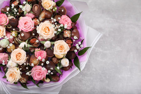 Beautiful food bouquet on light gray table, top view. Space for textの写真素材