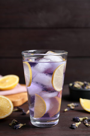 Organic blue Anchan with lemon in glass on wooden table. herbal teaの写真素材