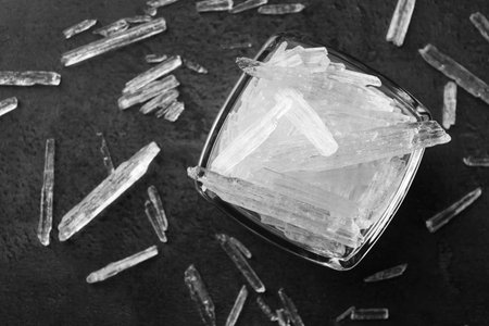 Menthol crystals on gray background, flat layの写真素材