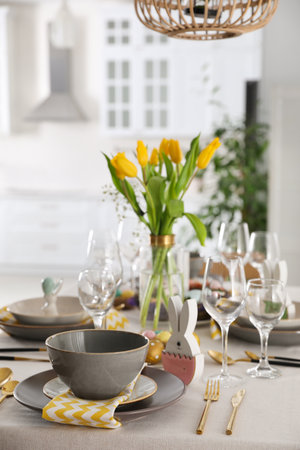 Beautiful Easter table setting with festive decor indoors