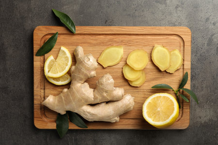 Fresh lemon and ginger on gray table, top viewの写真素材