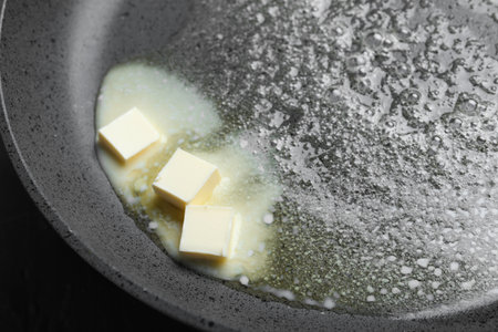 Melting butter in frying pan, closeup viewの写真素材