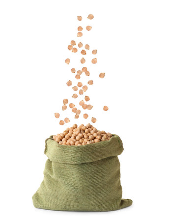Raw chickpeas falling into bag on white backgroundの写真素材