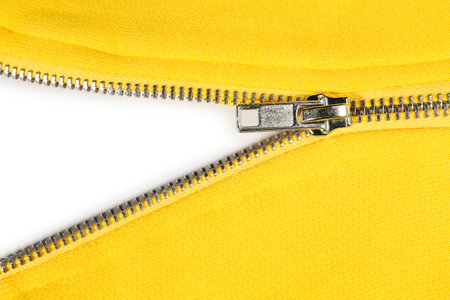 Yellow sweatshirt with zipper as background, top viewの写真素材