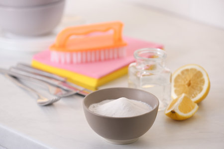 Baking soda, lemon and vinegar on white table. eco-friendly detergentsの写真素材
