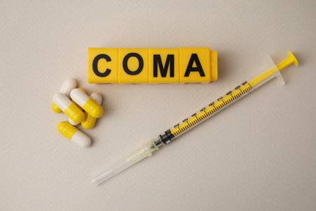 Word Coma of cubes, syringe and pills on beige background, flat layの写真素材